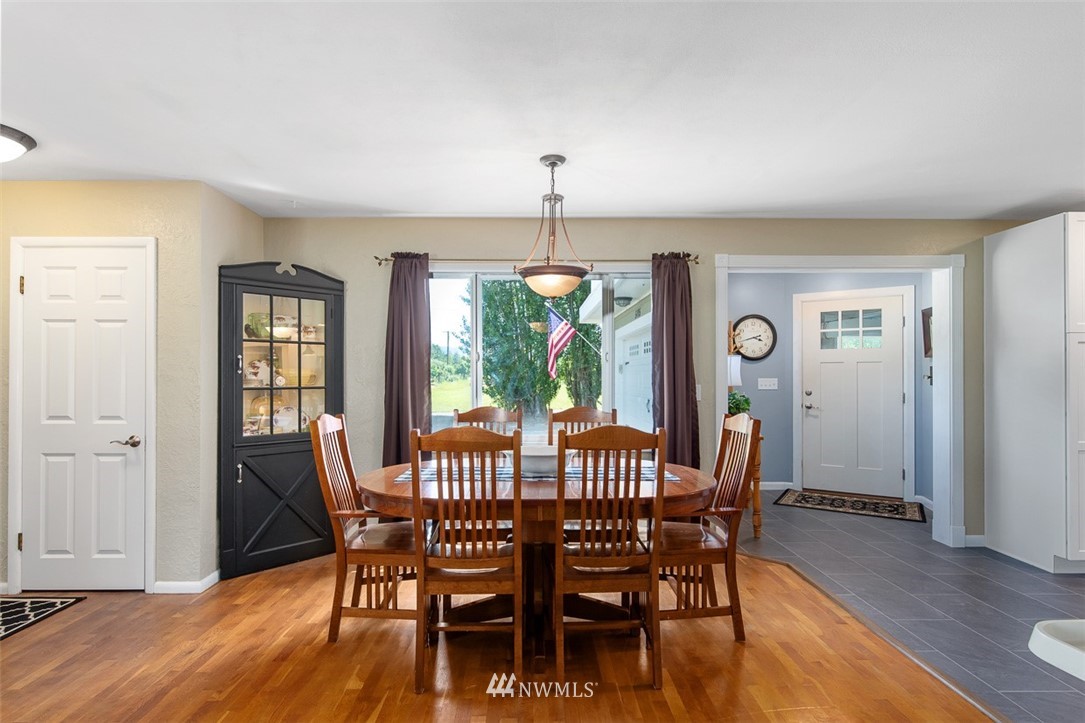 5495 Sand Road Bellingham, WA 98226 - Photo 7 of 40 a view of a dining room with furniture window and wooden floor