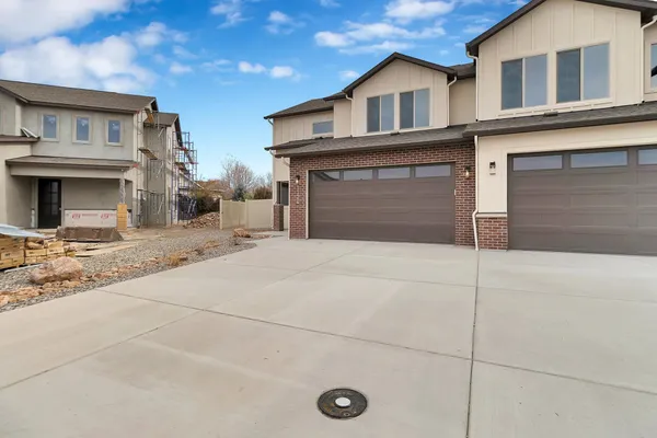 a view of a house with more windows and a road