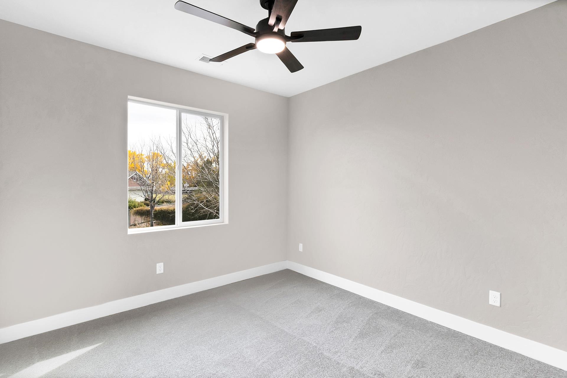 1124 Sprocket Court Fruita, CO 81521 - Photo 36 of 40 an empty room with a window and a fan