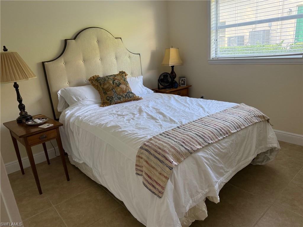 1927 Crayton Road Naples, FL 34102 - Photo 18 of 21 Tiled bedroom with baseboards
