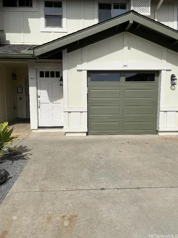 a view of a house with a garage