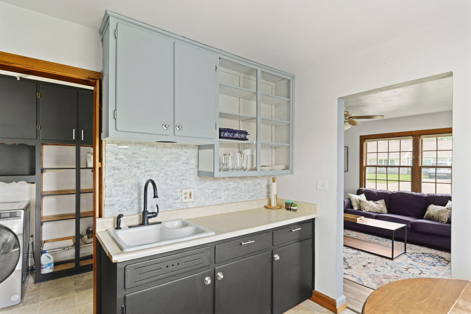2330 39th Street Rock Island, IL 61201 - Photo 11 of 32 a kitchen with a sink cabinets and a window