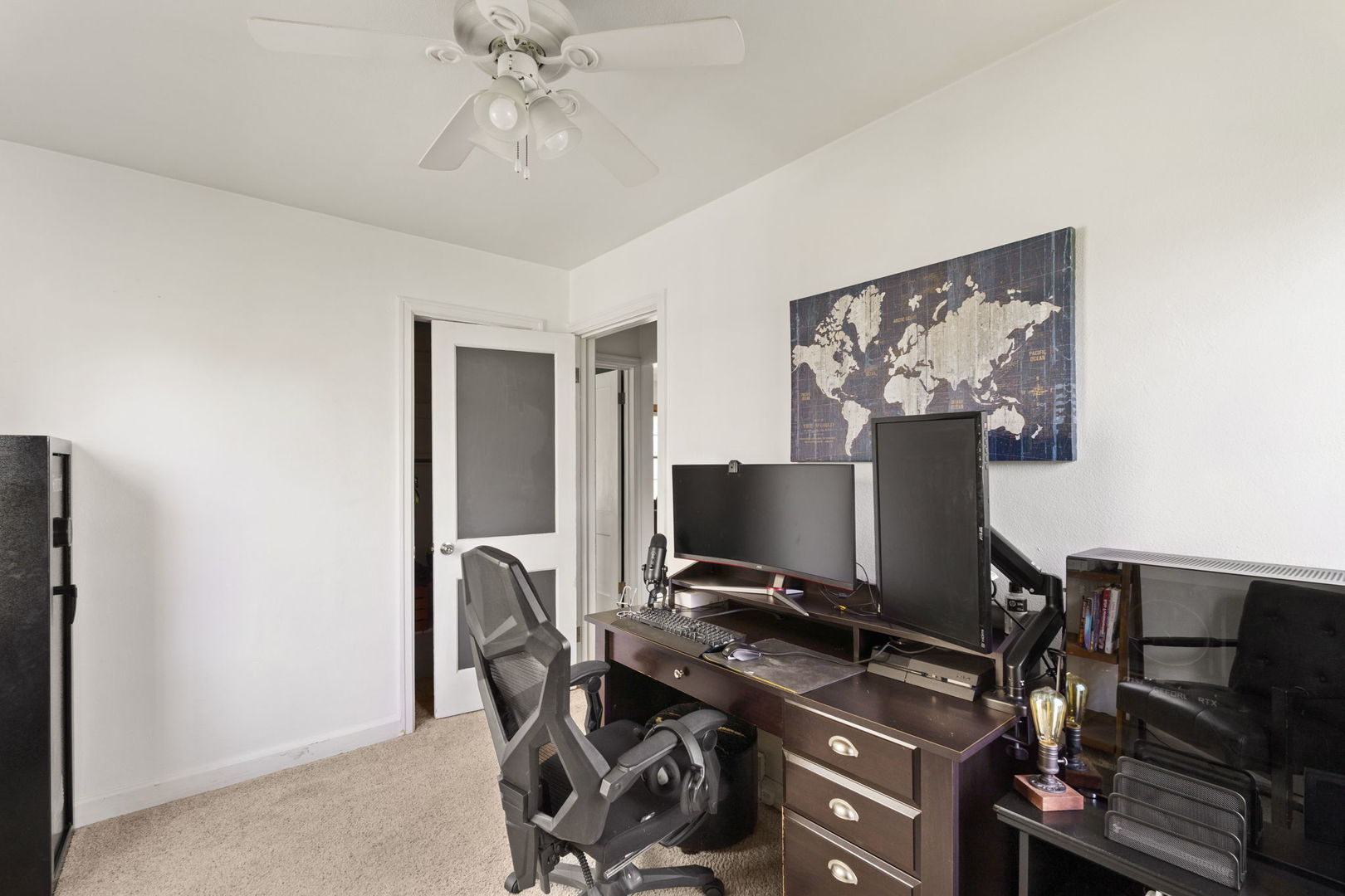 2330 39th Street Rock Island, IL 61201 - Photo 19 of 32 a view of a workspace with furniture and a ceiling fan