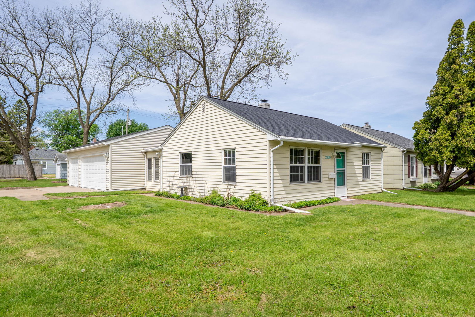 2330 39th Street Rock Island, IL 61201 - Photo 2 of 32 a view of a house with a yard and trees