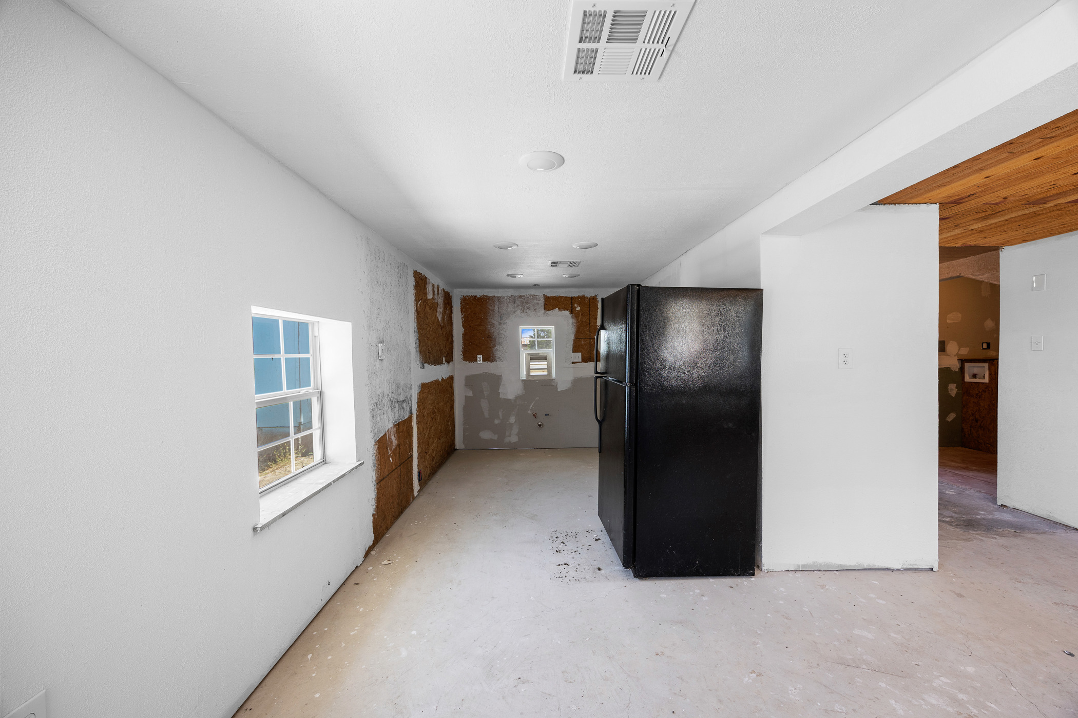 147 Community Center Road Rosanky, TX 78953 - Photo 25 of 33 Kitchen with freestanding refrigerator and concrete floors