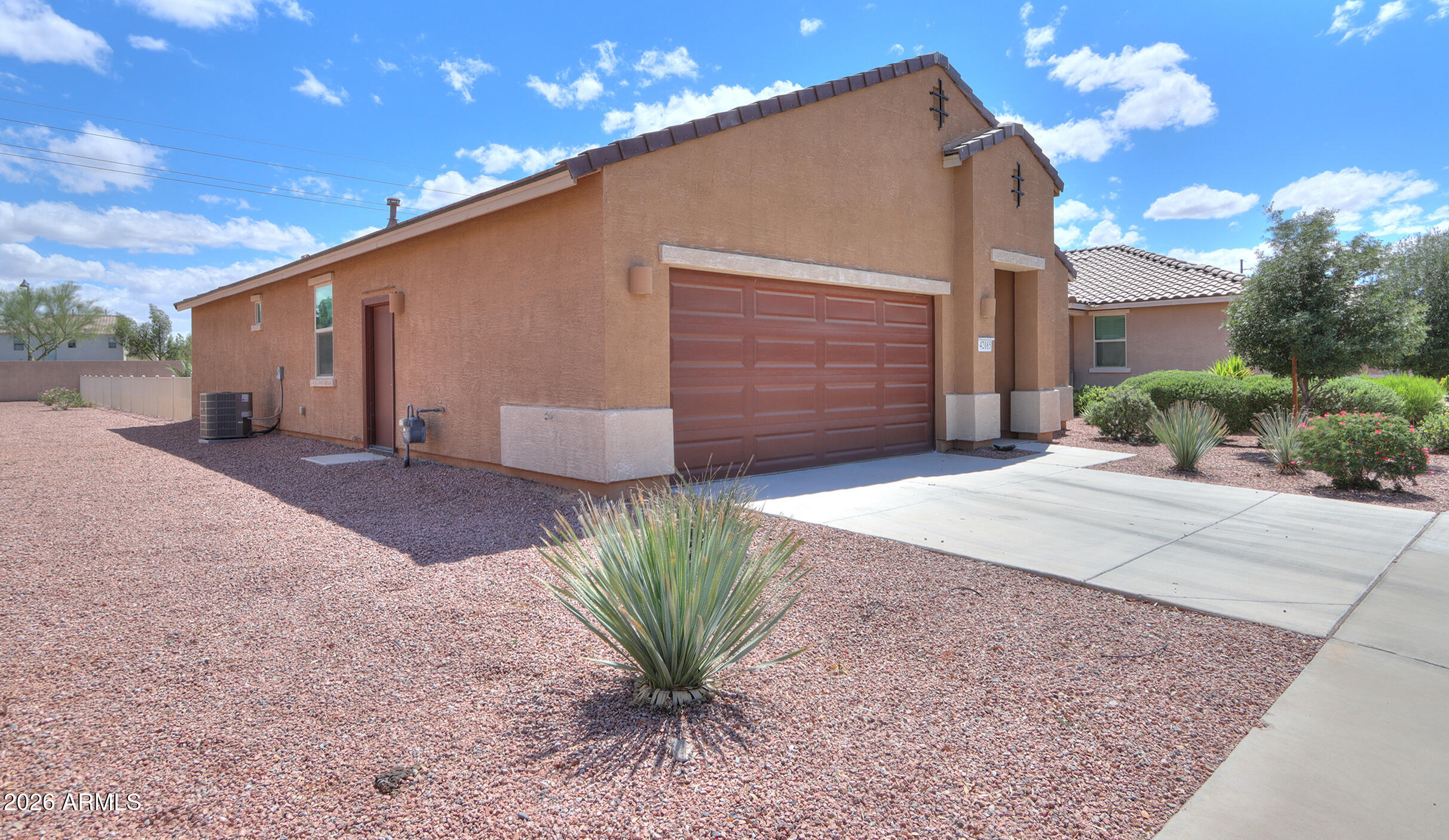 42085 West Cribbage Road Maricopa, AZ 85138 - Photo 2 of 35 a front view of a house with a yard and garage