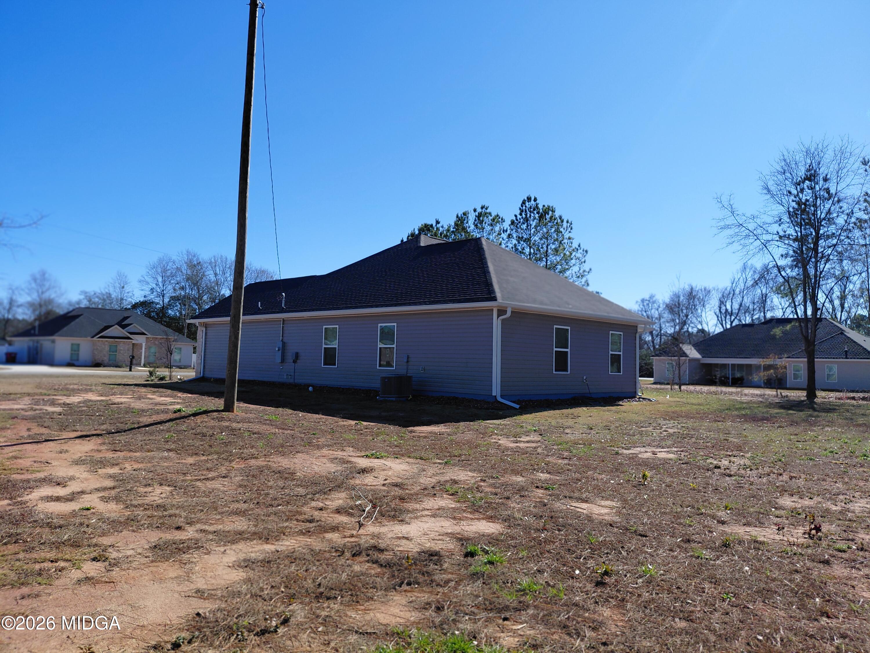321 Browning Pointe Road Macon, GA 31216 - Photo 17 of 20 a house view with a backyard space