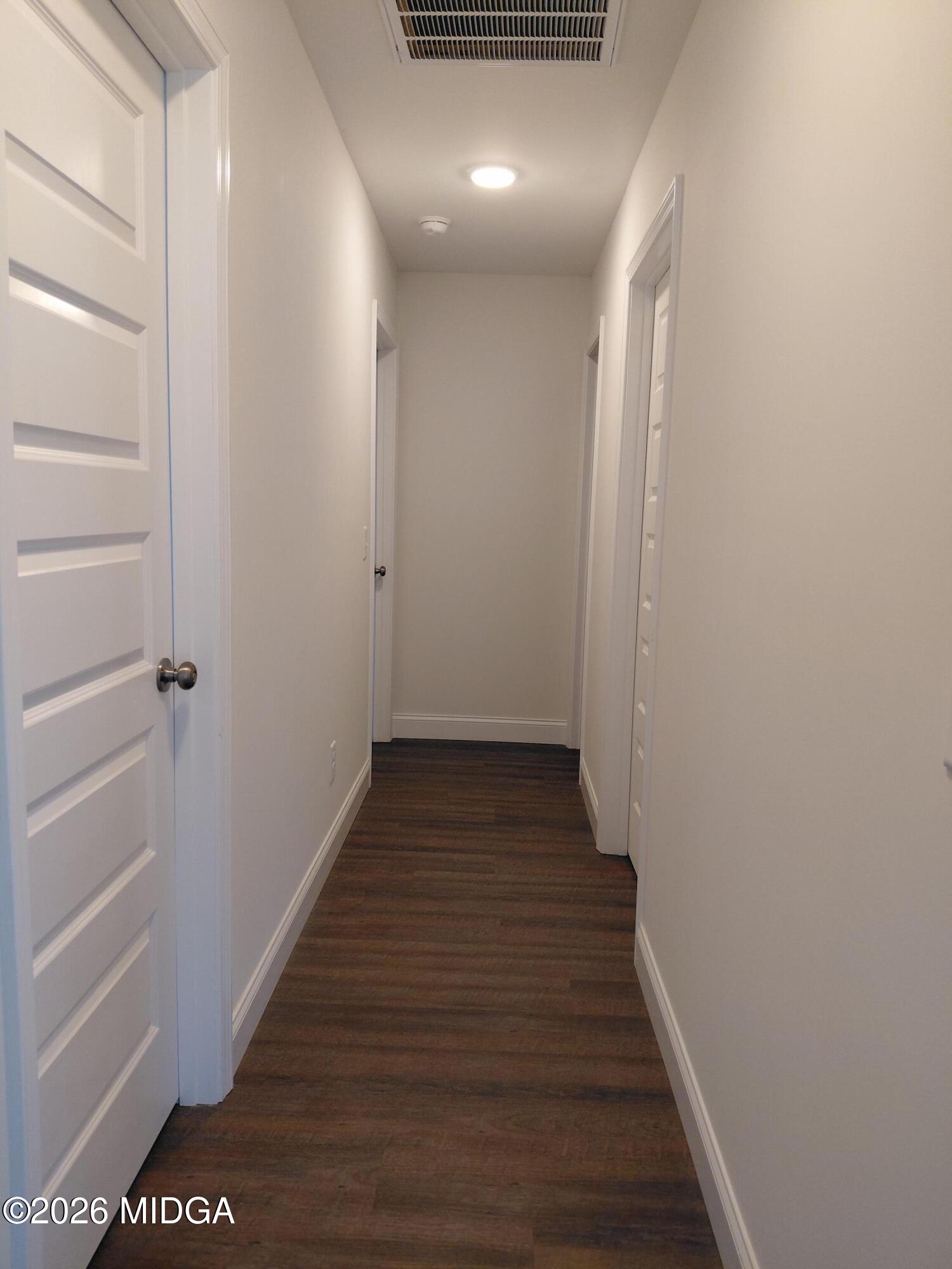 321 Browning Pointe Road Macon, GA 31216 - Photo 10 of 20 a view of a hallway with wooden floor