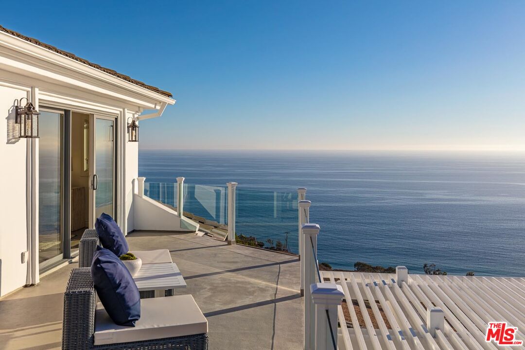 Carbon Mesa Road Malibu, CA 90265 - Photo 20 of 42 a view of roof deck with wooden floor and seating space