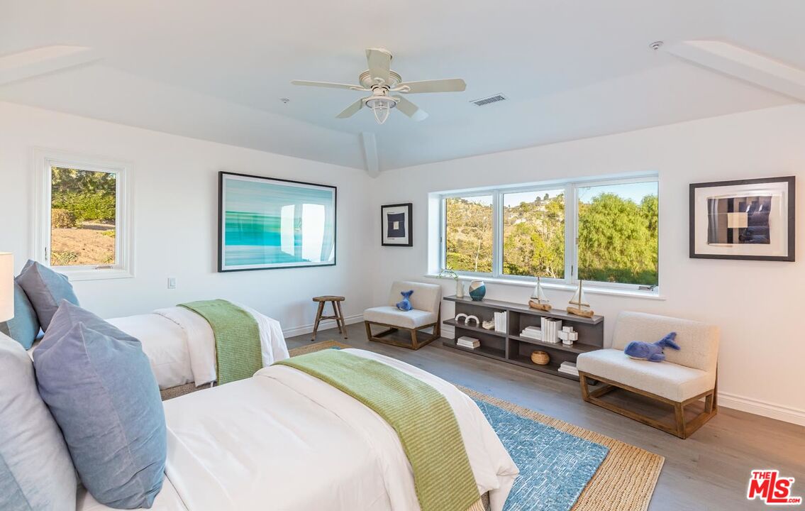 Carbon Mesa Road Malibu, CA 90265 - Photo 22 of 42 a living room with a couch chair and a window