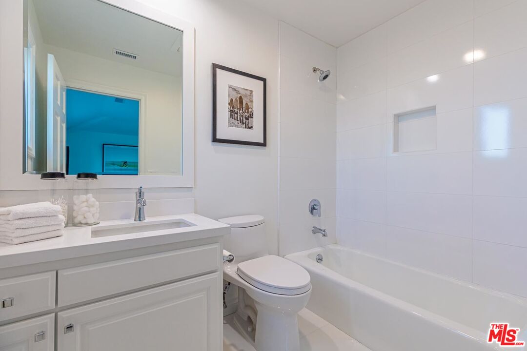Carbon Mesa Road Malibu, CA 90265 - Photo 23 of 42 a bathroom with a toilet a sink and bathtub