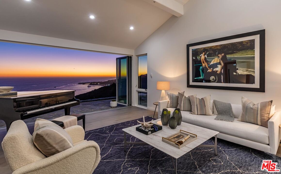 Carbon Mesa Road Malibu, CA 90265 - Photo 34 of 42 a living room with furniture and a flat screen tv