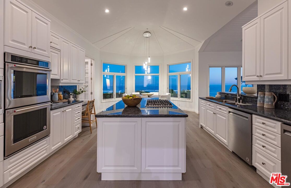 Carbon Mesa Road Malibu, CA 90265 - Photo 36 of 42 a kitchen with stainless steel appliances granite countertop a stove and a sink
