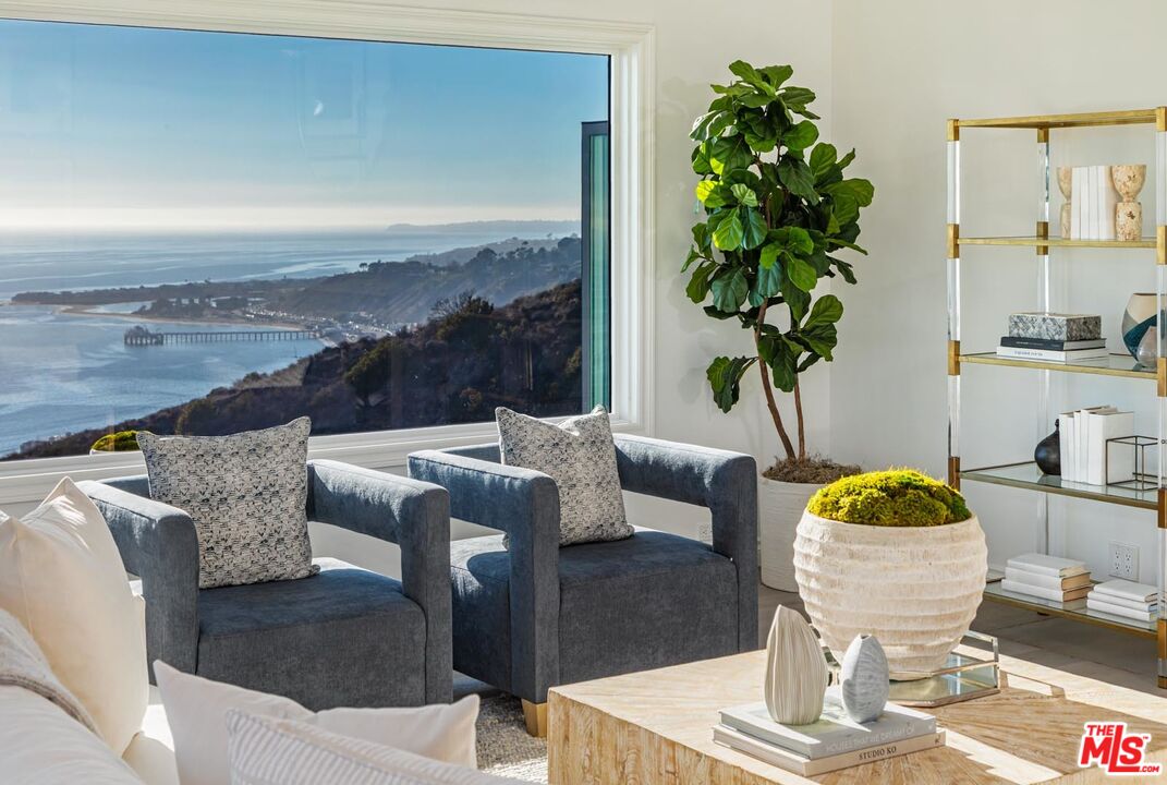 Carbon Mesa Road Malibu, CA 90265 - Photo 9 of 42 a living room with furniture and a potted plant