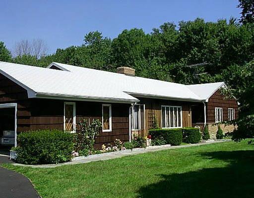 15 Haverhill Road Trumbull, CT 06611 - Photo 1 of 1 a front view of a house with a yard
