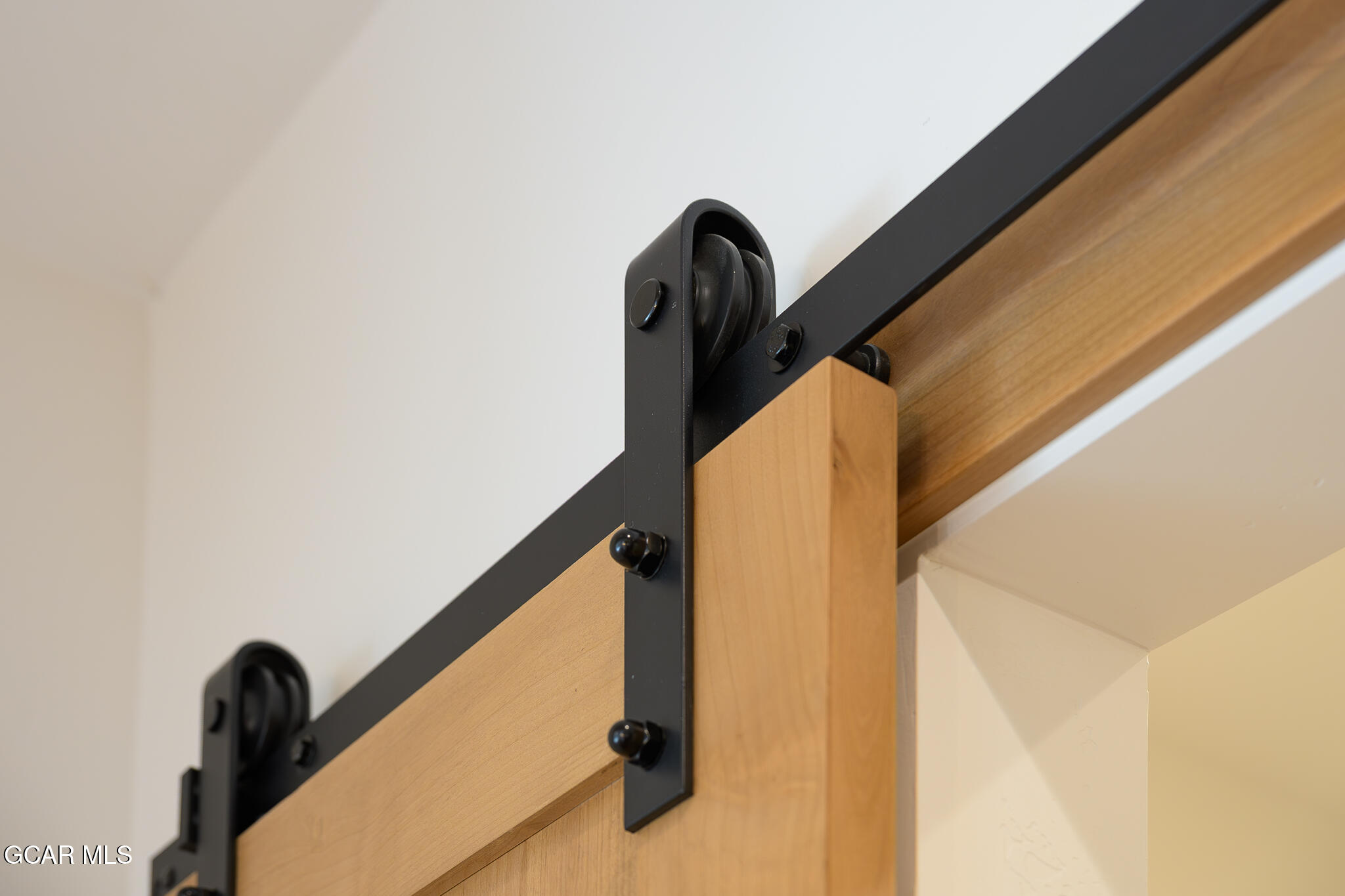 96 Meadow Trail, Unit G101 Fraser, CO 80442 - Photo 12 of 19 a view of balcony with wooden floor and window