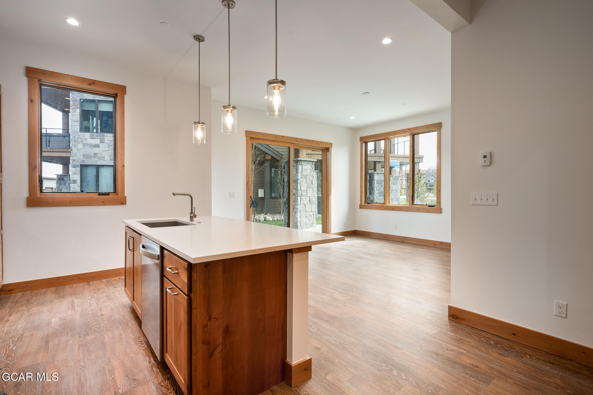 96 Meadow Trail, Unit G101 Fraser, CO 80442 - Photo 15 of 19 wooden floor in an empty room with a window and wooden floor