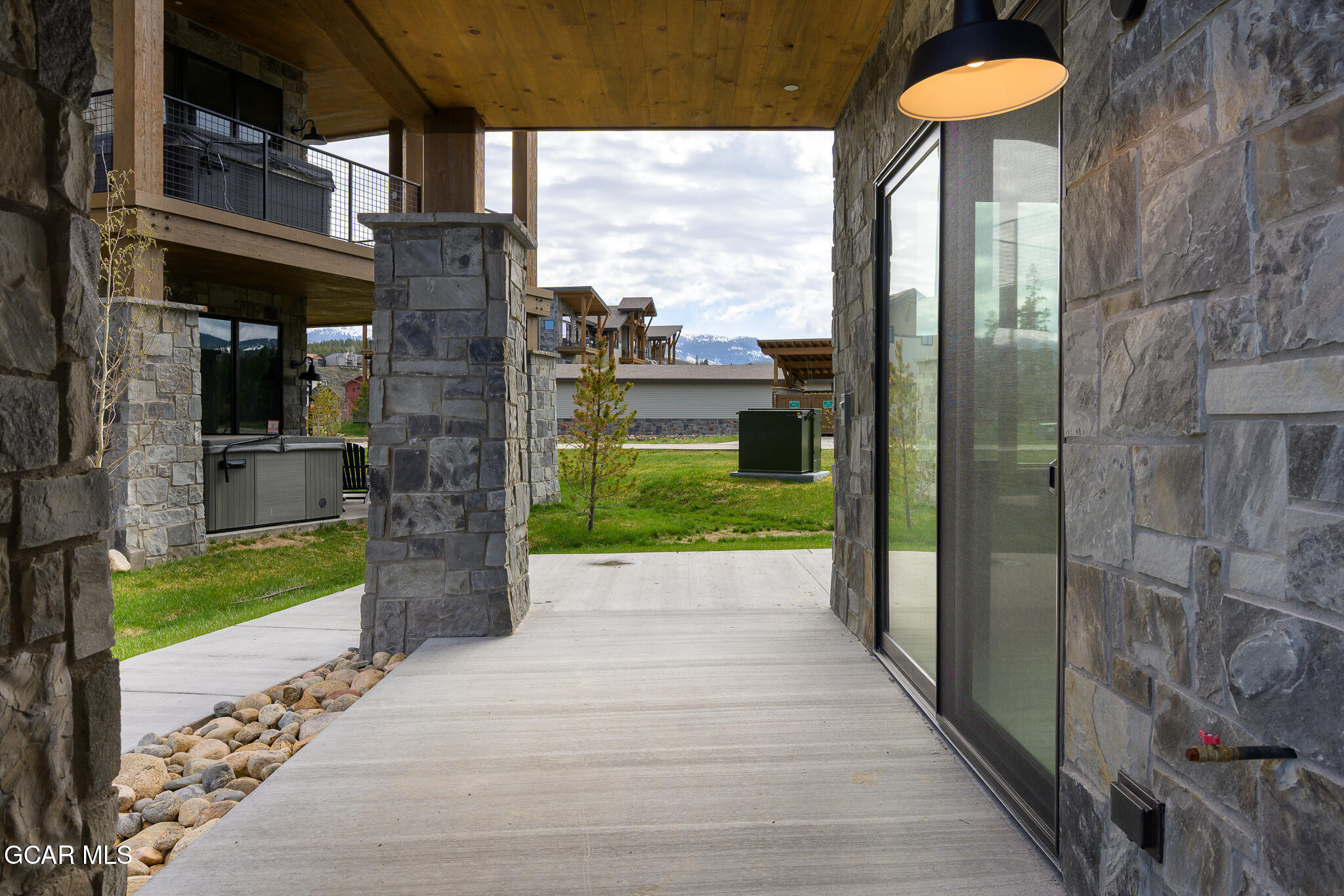 96 Meadow Trail, Unit G101 Fraser, CO 80442 - Photo 16 of 19 a view of a garden from a building