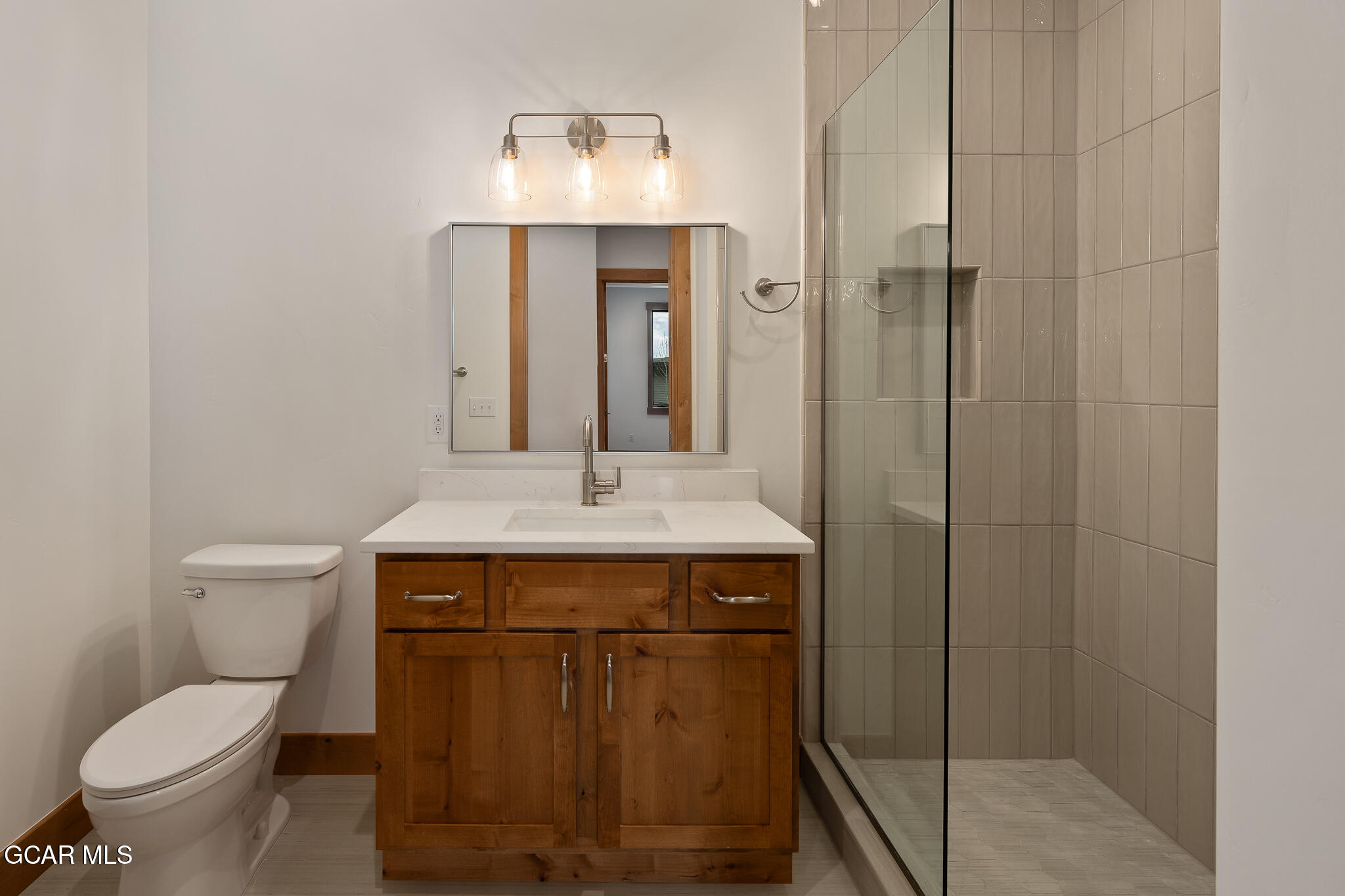 96 Meadow Trail, Unit G101 Fraser, CO 80442 - Photo 8 of 19 a bathroom with a sink and a toilet
