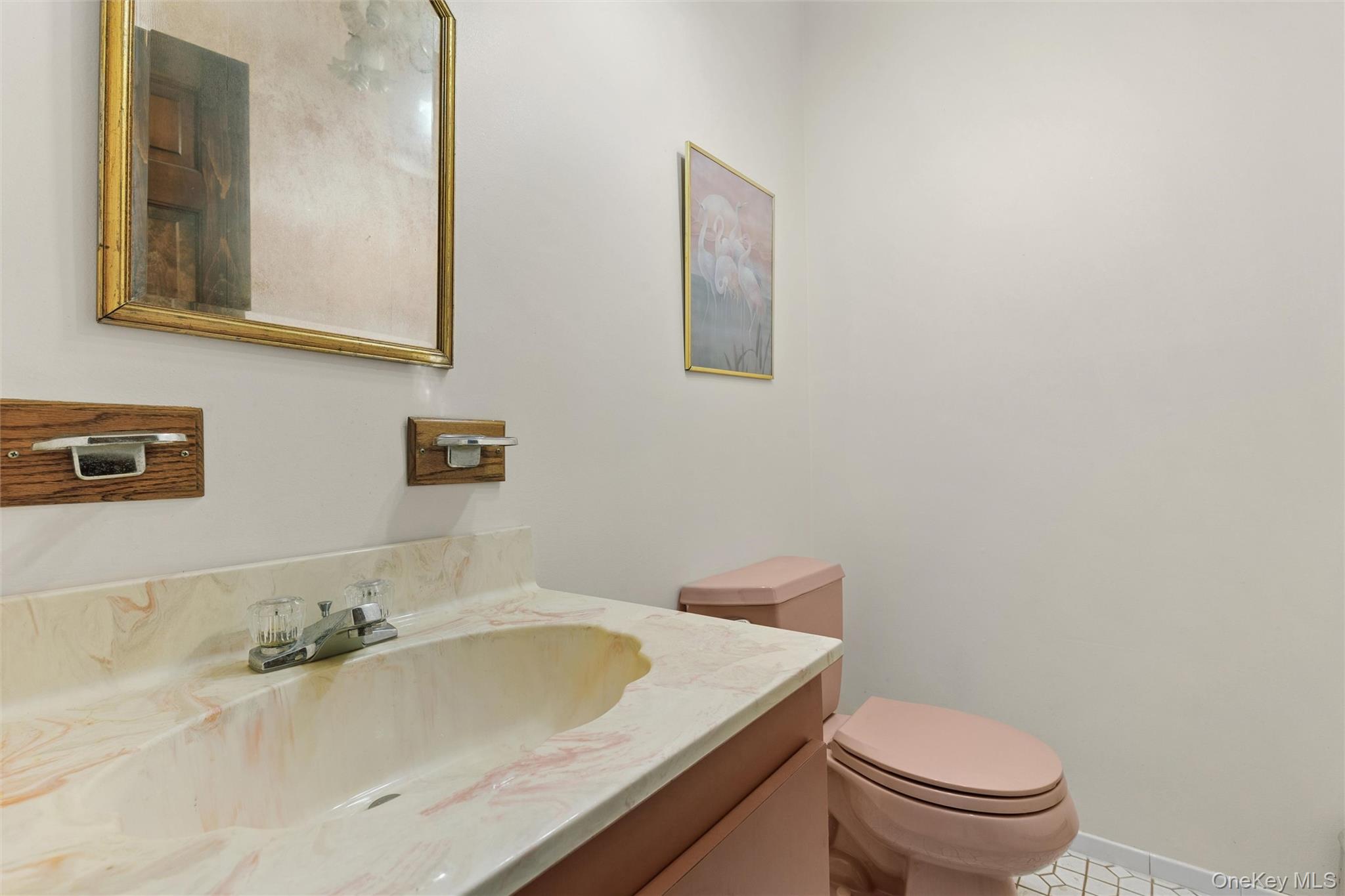 49 Overhill Road Wading River, NY 11792 - Photo 12 of 27 a bathroom with a sink and a toilet