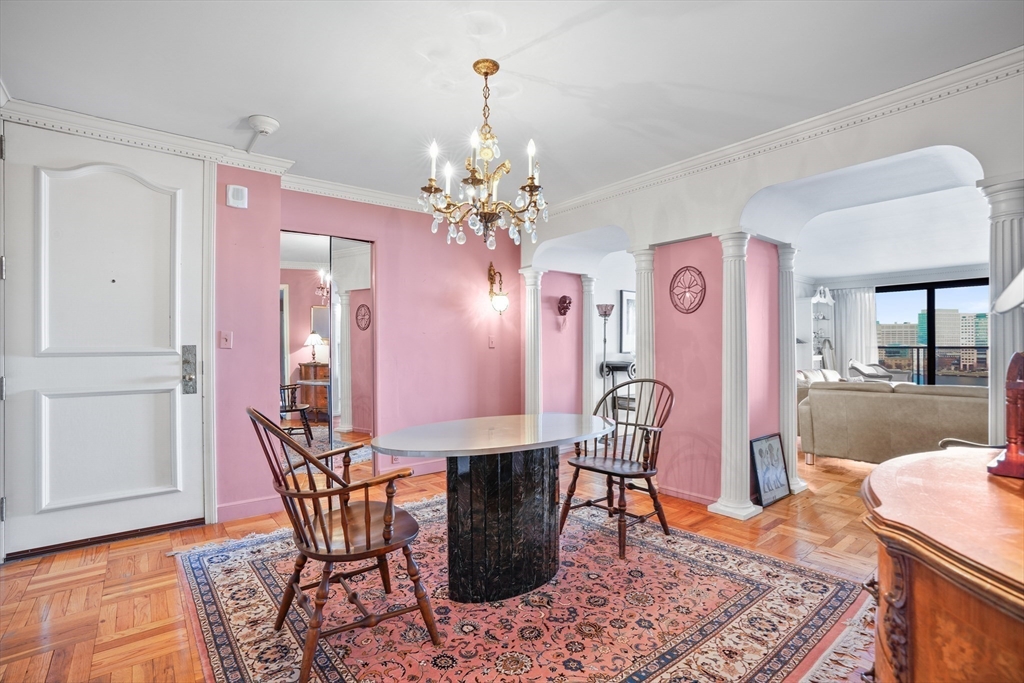 180 Beacon Street, Unit 14FG Boston, MA 02116 - Photo 23 of 40 a view of a dining room with furniture