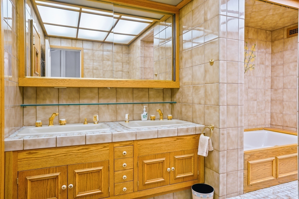 180 Beacon Street, Unit 14FG Boston, MA 02116 - Photo 30 of 40 a bathroom with a sink and a shower