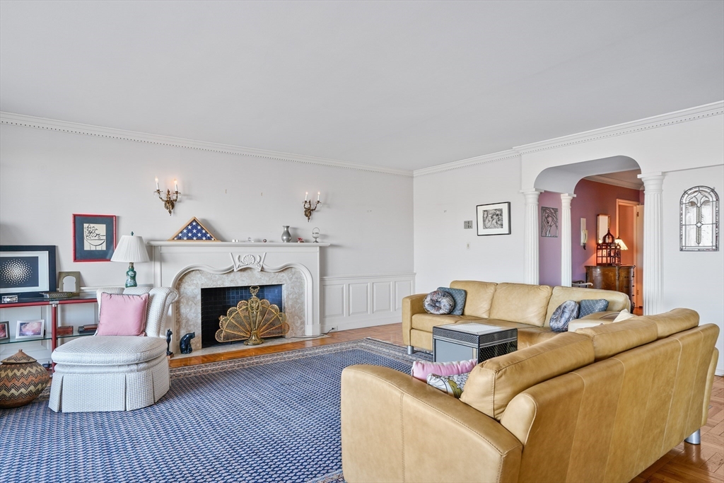 180 Beacon Street, Unit 14FG Boston, MA 02116 - Photo 5 of 40 a living room with furniture and a fireplace