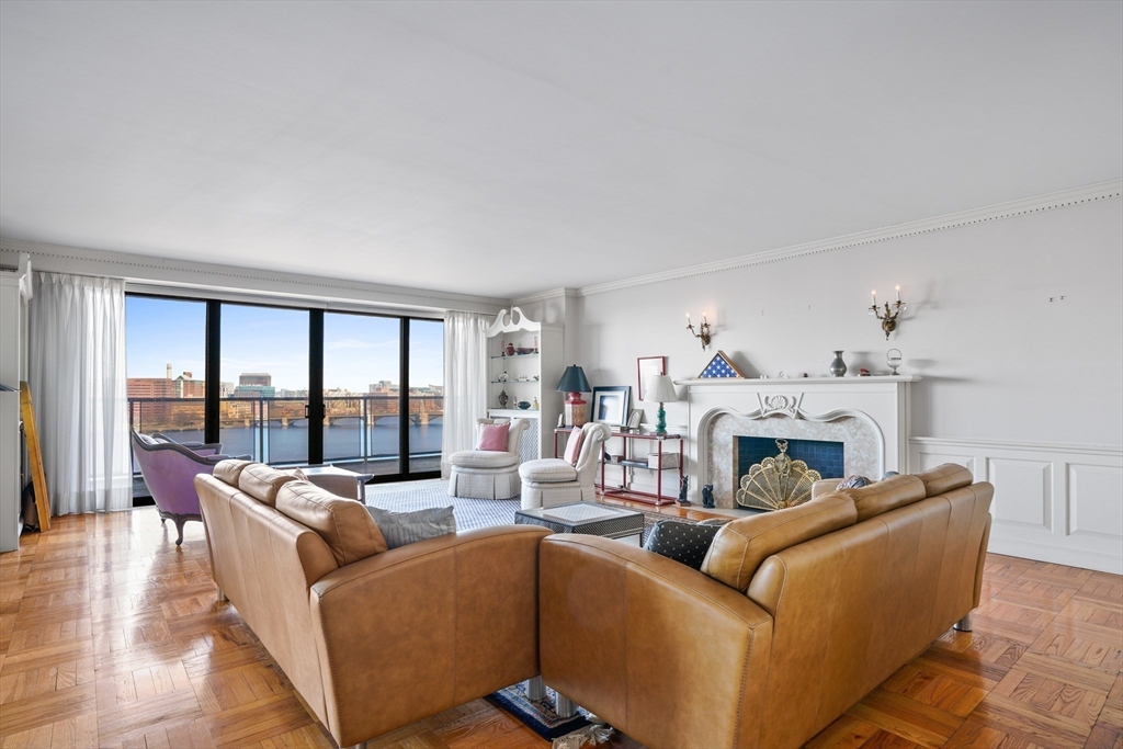180 Beacon Street, Unit 14FG Boston, MA 02116 - Photo 6 of 40 a living room with furniture and a fireplace