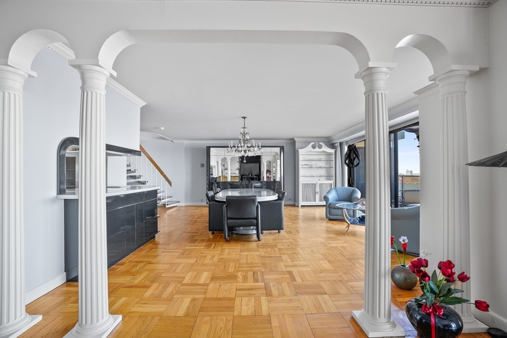 180 Beacon Street, Unit 14FG Boston, MA 02116 - Photo 9 of 40 a living room with furniture and a flat screen tv