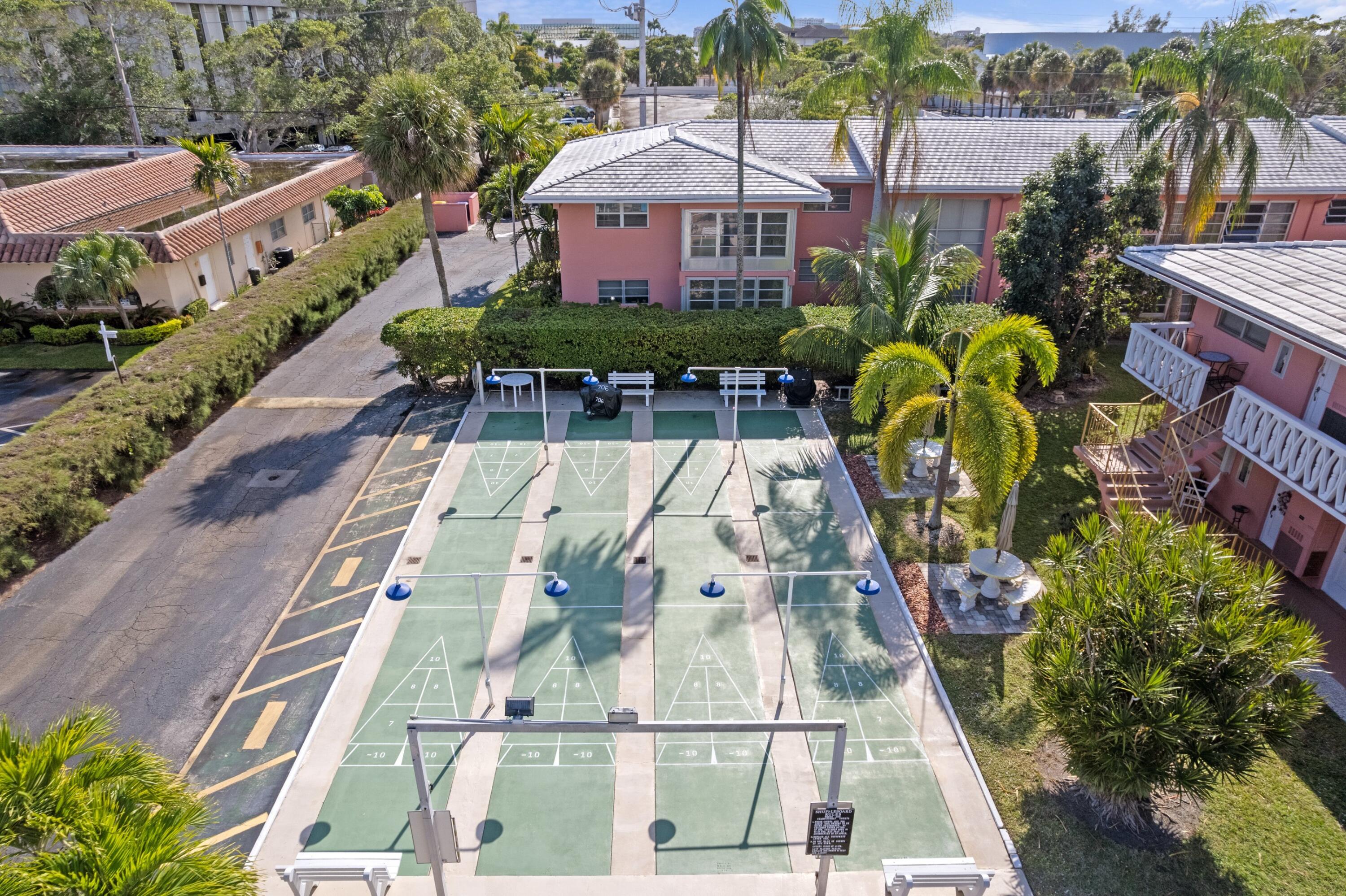 300 Northeast 20th Street, Unit 109 Boca Raton, FL 33431 - Photo 16 of 36 a view of a swimming pool with a patio