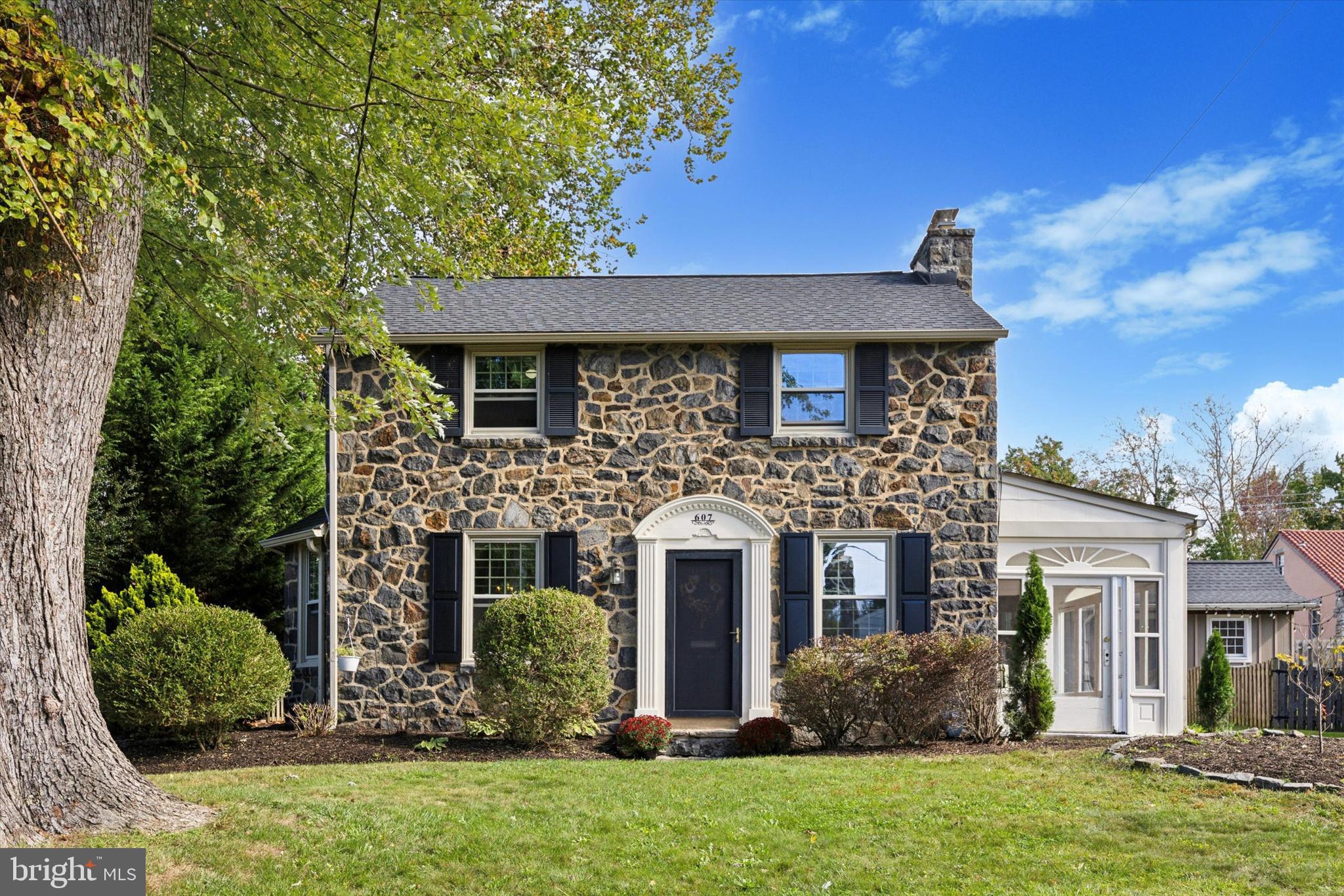 front view of a house with a yard
