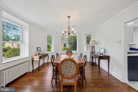 a dining room with furniture window wooden floor
