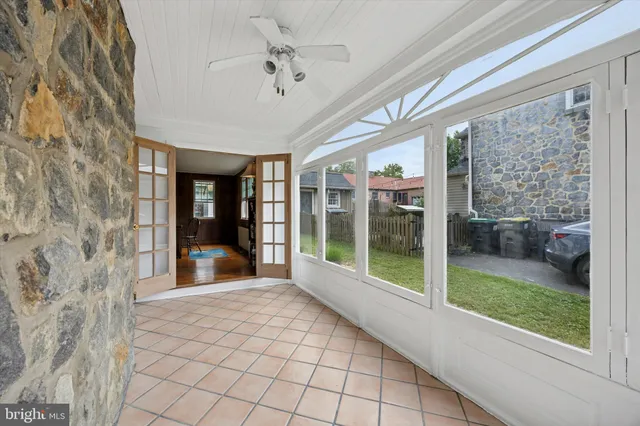 a view of an entryway with a floor to ceiling window