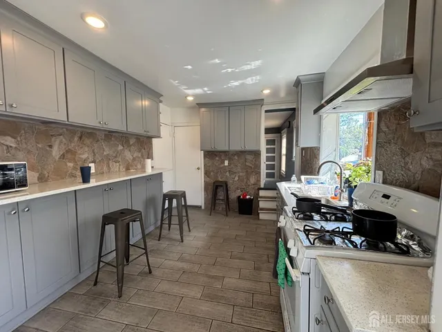 a kitchen with counter space cabinets and appliances