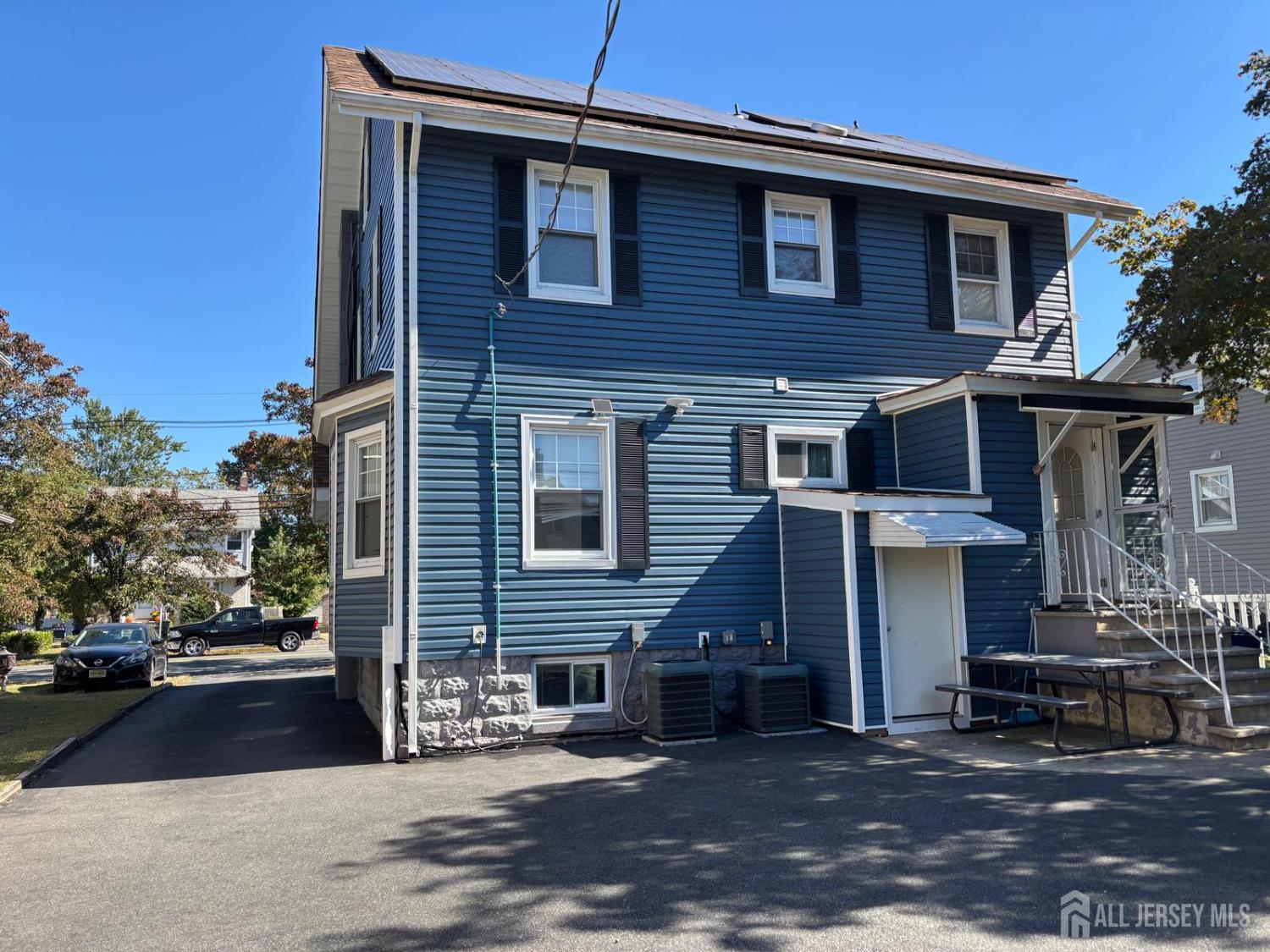 220 South Washington Avenue Dunellen, NJ 08812 - Photo 10 of 11 a front view of a house with a yard