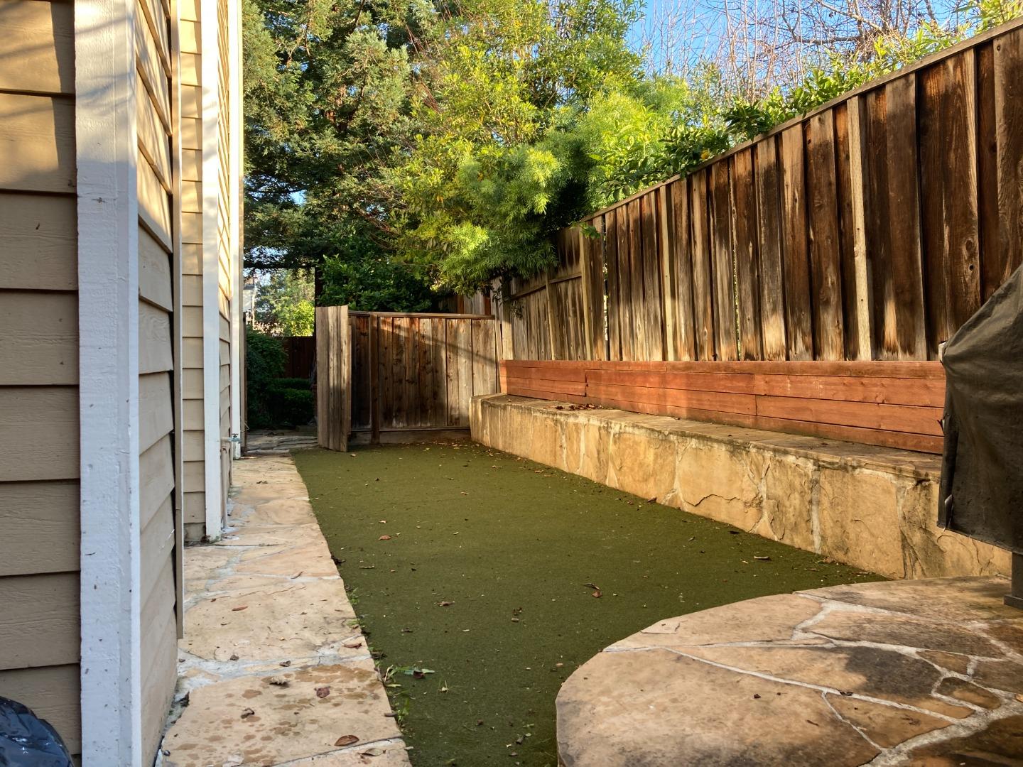 1107 Lautrec Terrace Sunnyvale, CA 94087 - Photo 15 of 16 a view of a backyard with door