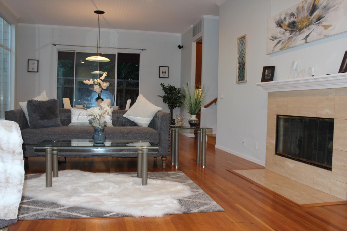 1107 Lautrec Terrace Sunnyvale, CA 94087 - Photo 2 of 16 a living room with furniture and a fireplace