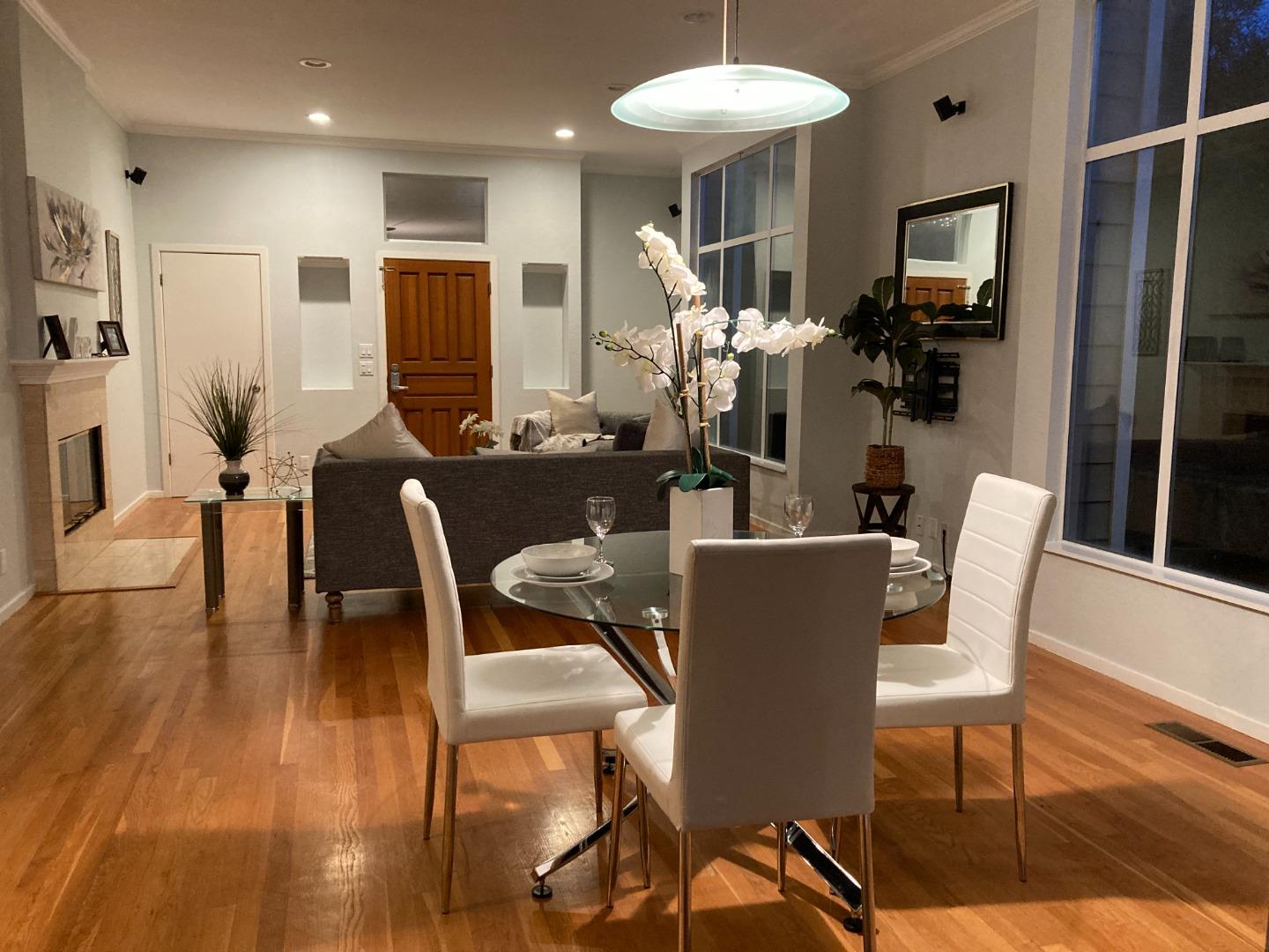 1107 Lautrec Terrace Sunnyvale, CA 94087 - Photo 3 of 16 a dining room with furniture a chandelier and wooden floor