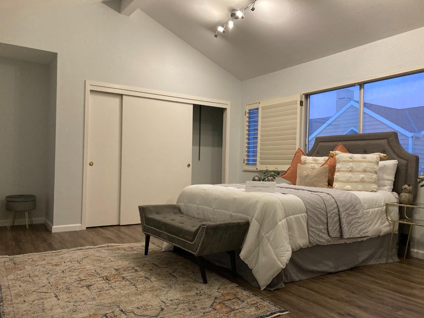 1107 Lautrec Terrace Sunnyvale, CA 94087 - Photo 6 of 16 a bedroom with a bed and a mirror