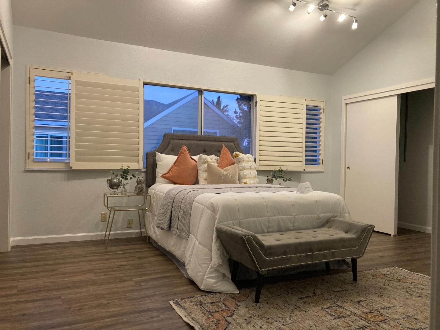 1107 Lautrec Terrace Sunnyvale, CA 94087 - Photo 7 of 16 a bedroom with a bed and wooden floor