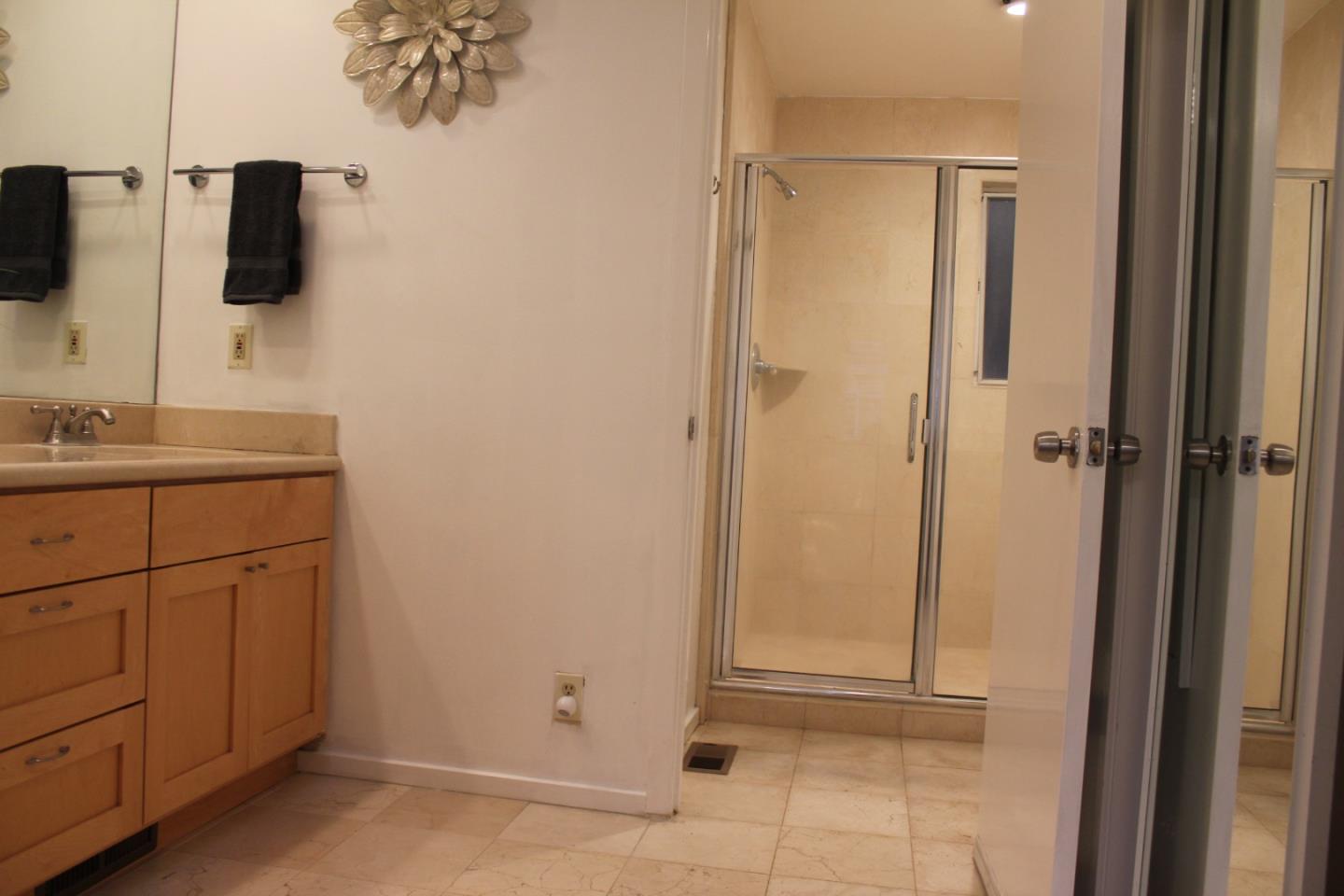 1107 Lautrec Terrace Sunnyvale, CA 94087 - Photo 8 of 16 a bathroom with a sink and mirror