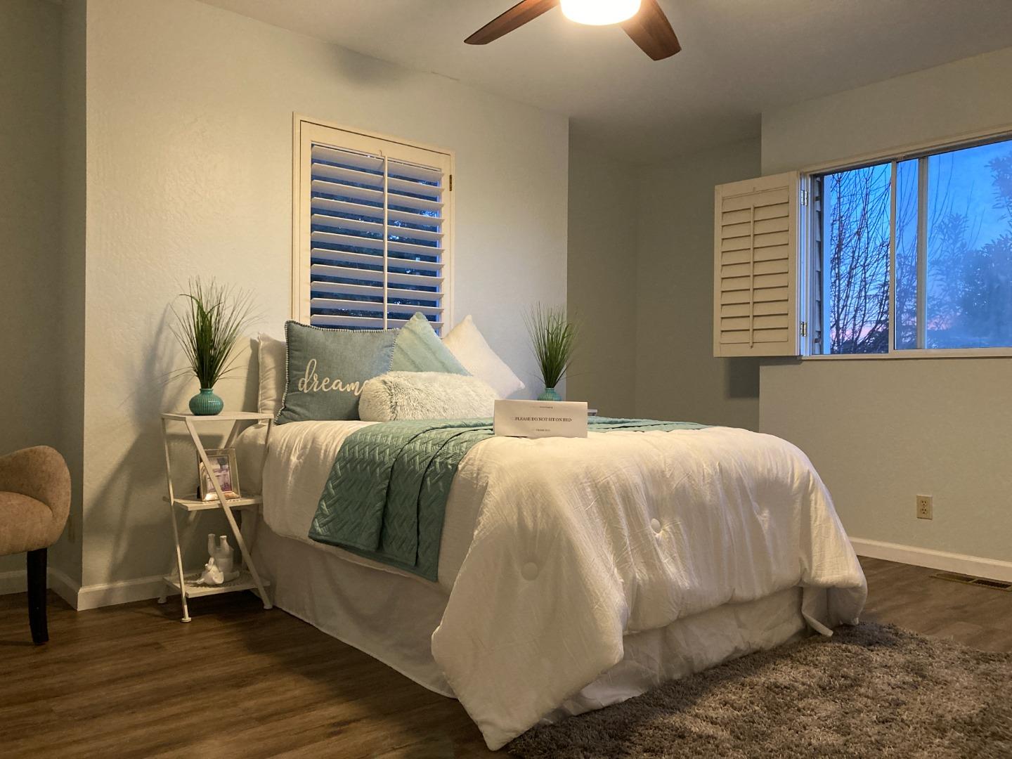 1107 Lautrec Terrace Sunnyvale, CA 94087 - Photo 9 of 16 a bedroom with a bed and a window