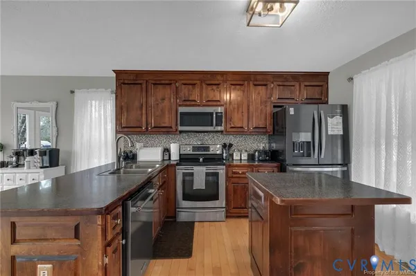 a kitchen with a refrigerator a sink and a refrigerator