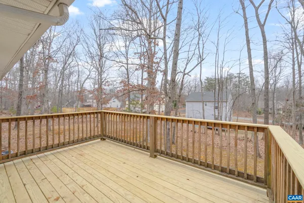 a view of balcony with wooden floor