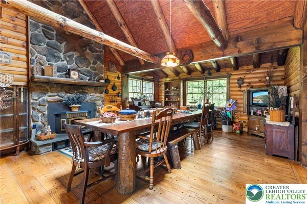 a living room with lots of wooden furniture