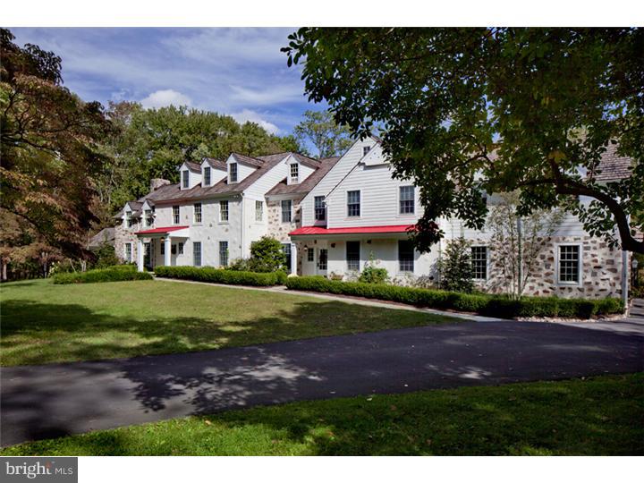 2220 Grubbs Mill Road Berwyn, PA 19312 - Photo 1 of 25 a front view of a house with a yard