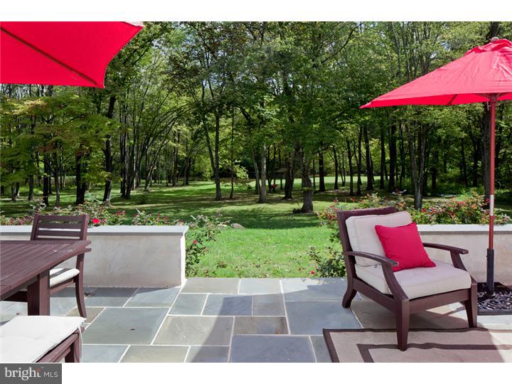2220 Grubbs Mill Road Berwyn, PA 19312 - Photo 21 of 25 a view of a patio with a table and chairs