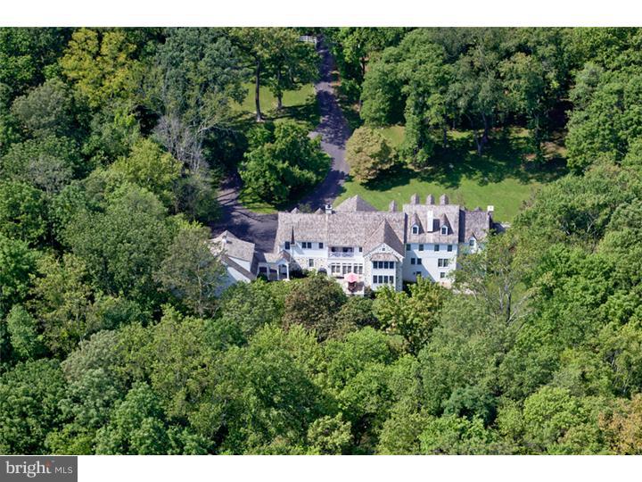 2220 Grubbs Mill Road Berwyn, PA 19312 - Photo 24 of 25 a view of a house with a street lush green forest