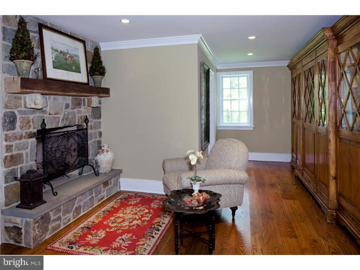 2220 Grubbs Mill Road Berwyn, PA 19312 - Photo 7 of 25 a living room with furniture and a fireplace