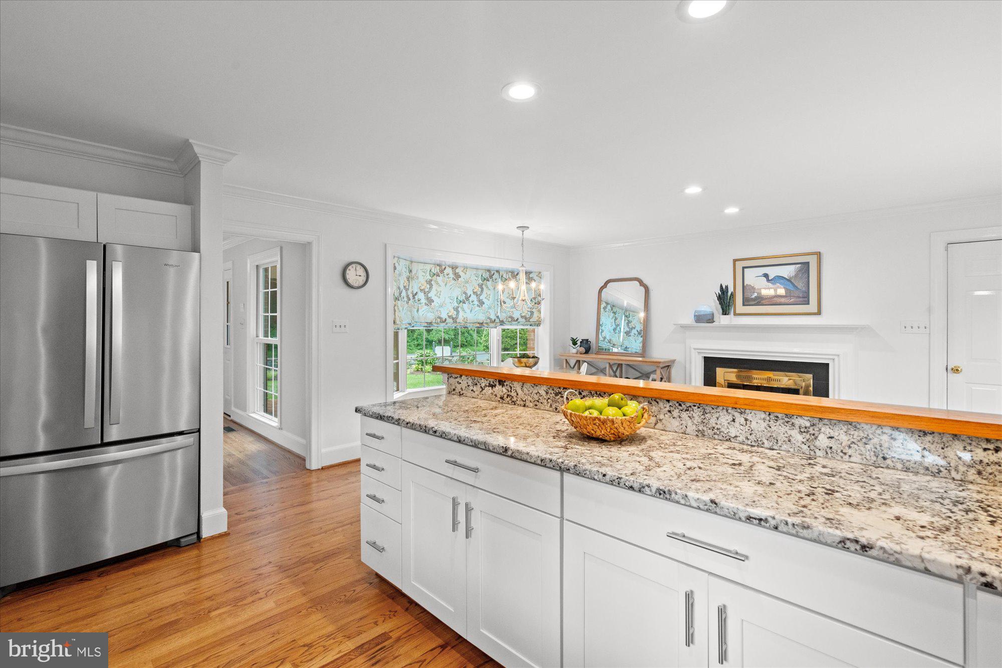 7287 Evans Mill Road McLean, VA 22101 - Photo 12 of 30 a kitchen with sink refrigerator and window